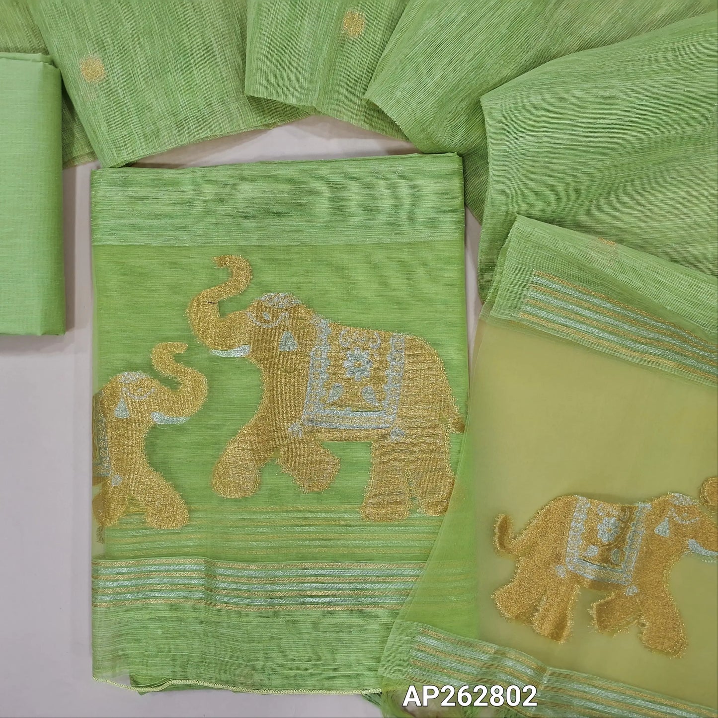 Designer pastel green jamdani woven premium tussar unstitched salwar material, (thin,lining needed)gold and silver zari weaving on organza daman, silk cotton bottom, jamdani woven on tussar silk dupatta with tassels and organza pallu . AP262802