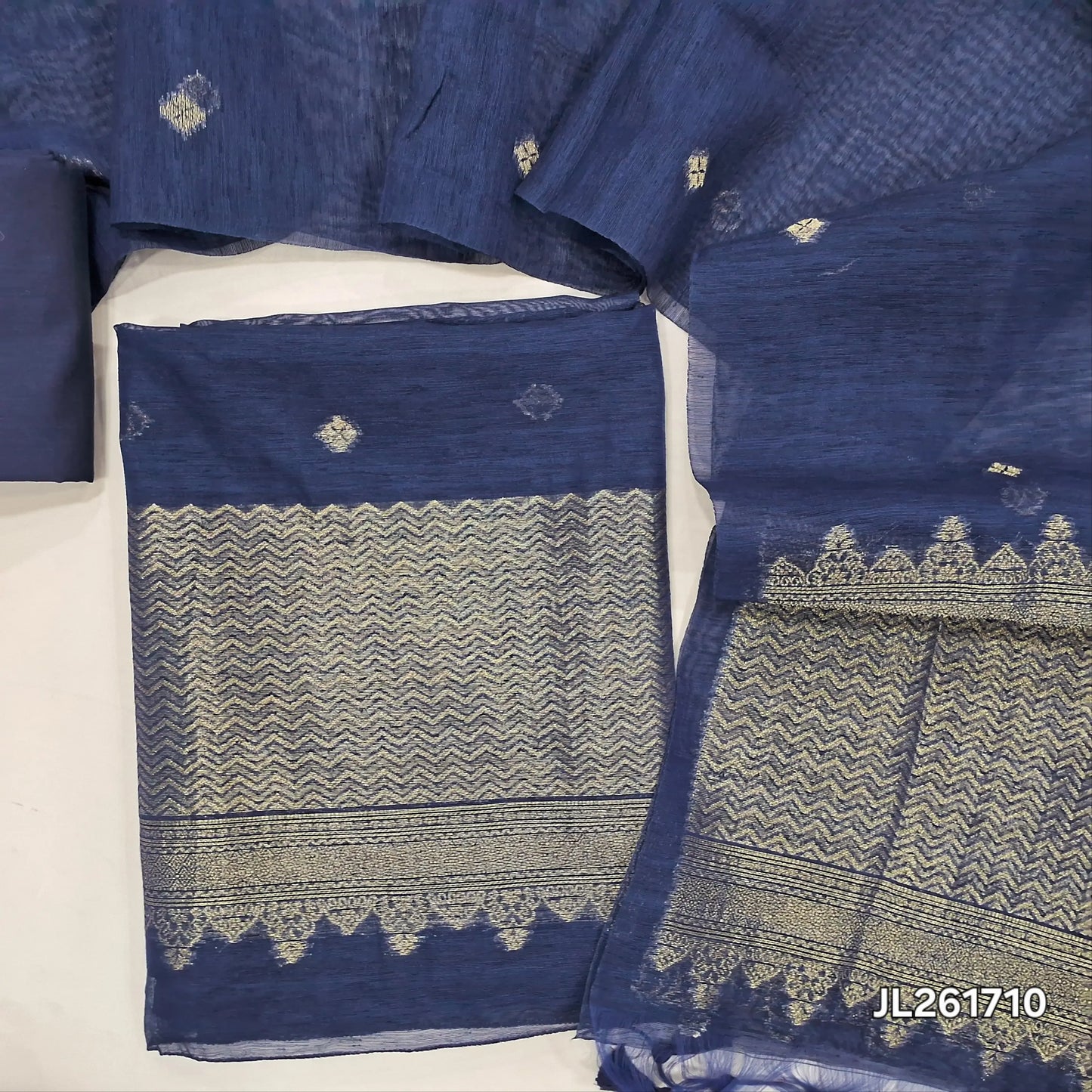 Dark blue jamdani woven premium tussar unstitched salwar material,buttas on front,antic gold zari weaving daman, (Thin, textured, lining needed)silk cotton bottom, buttas on full length tussar dupatta with rich pallu and tassles. JL261710