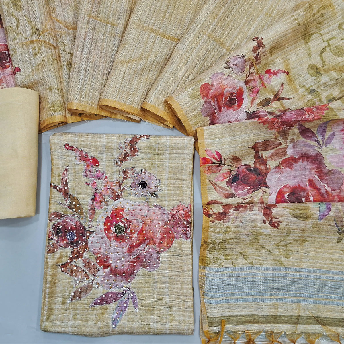 Rich beige premium tussar unstitched salwar material, hand work on yoke(thin fabric, lining needed)rich hand work on daman, matching santoon bottom, floral printed premium tussar dupatta with tassels. CODE JL242102