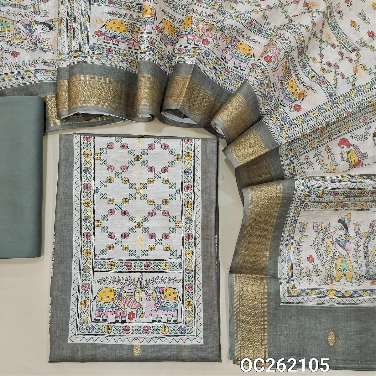 Grey digital premium silk cotton unstitched salwar material, printed yoke,zari buttas all over,(Thin, Lining Needed)spun cotton bottom,digital printed silk cotton dupatta with zari borders. OC262105