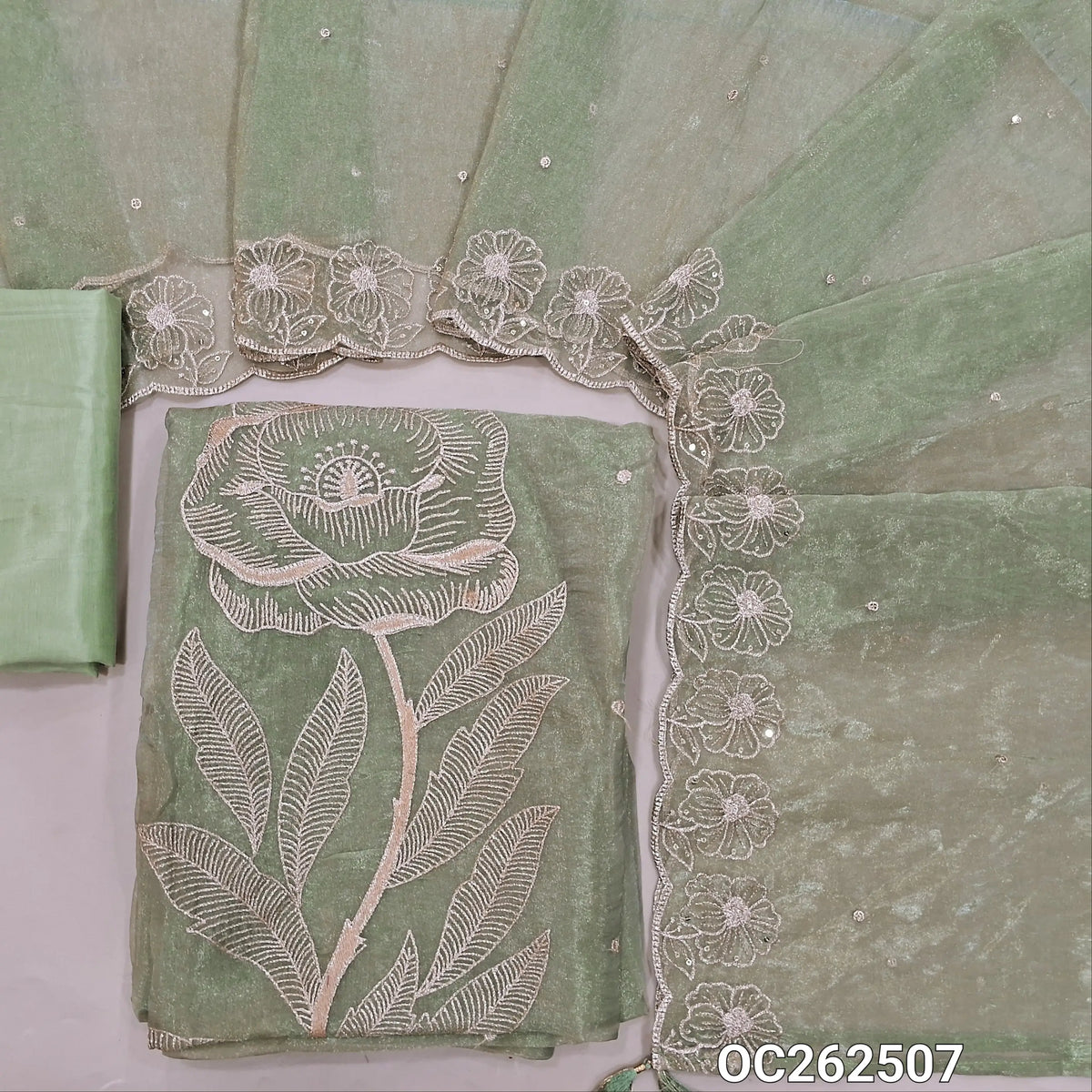 Pastel green with golden tint crinkled tissue organza silk unstitched salwar material,zari embroidery & sequins on front,(lining needed)silky fabric provided for bottom & lining, tissue organza silk dupatta with embroidery & scallop borders. OC262507