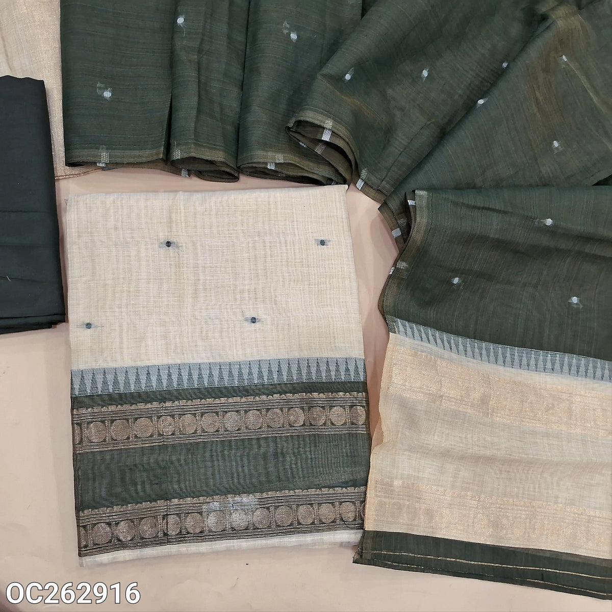 Off white and dark green silk cotton unstitched salwar material, gap bordes with temple weaving on daman, zari weaving on yoke (Thin, Lightweight, Lining Needed) silky bottom, silk cotton dupatta with thread woven buttas. OC262916