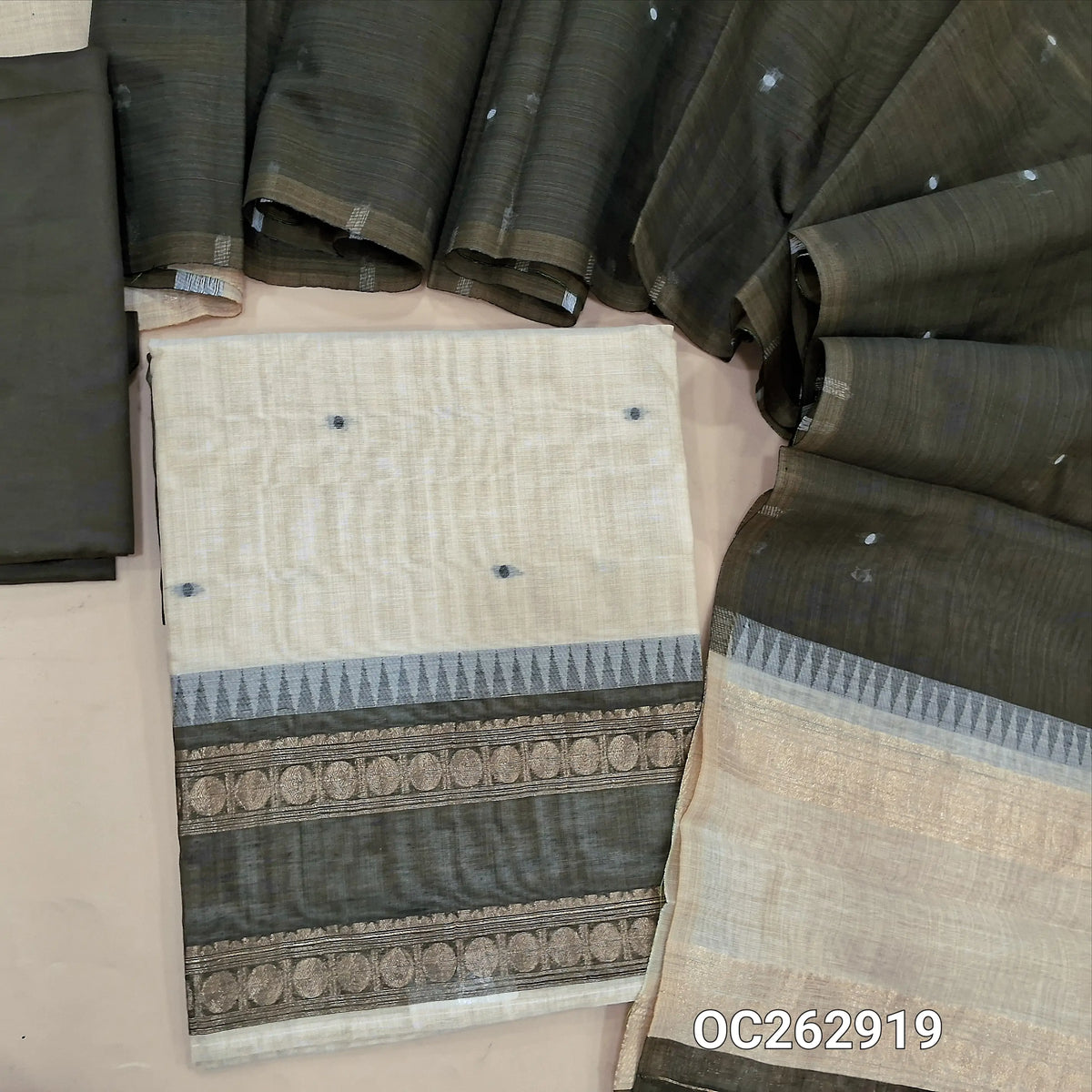 Off White and olive green silk cotton unstitched salwar material, gap bordes with temple weaving on daman, zari weaving on yoke (Thin, Lightweight, Lining Needed) silky bottom, silk cotton dupatta with thread woven buttas. OC262919