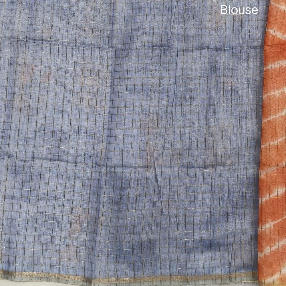 Orange with powder blue shibori printed soft silk cotton saree with zari checks all over, contrast animal prints on pallu, contrast running blouse with zari chceks and borders.NS69