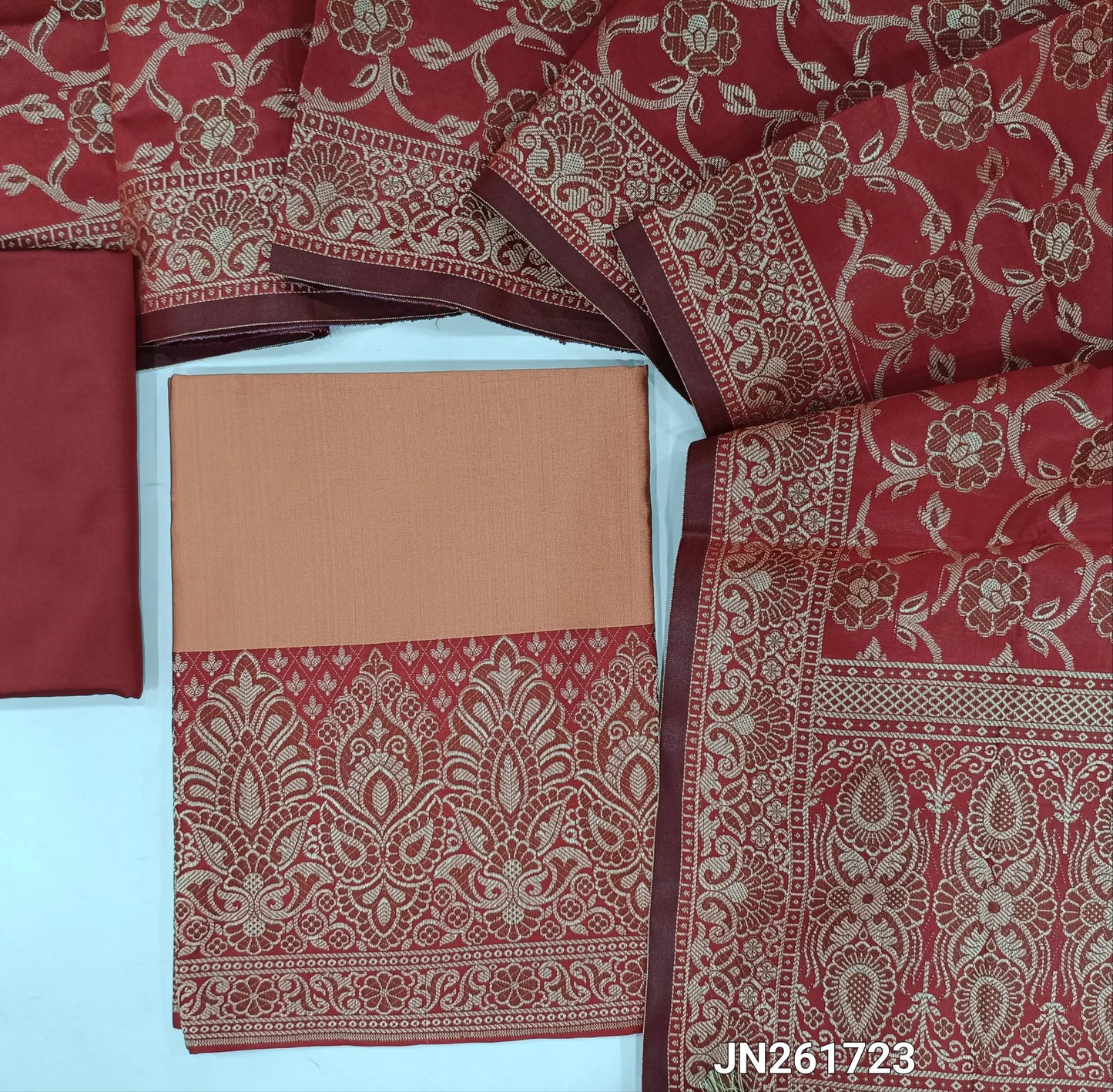 Pastel pink premium silk cotton unstitched salwar material, brocade weaving on daman,(Lining needed)reddish maroon silk cotton bottom, brocade weaving on silk cotton full length dupatta with rich pallu and tassles. JN261723