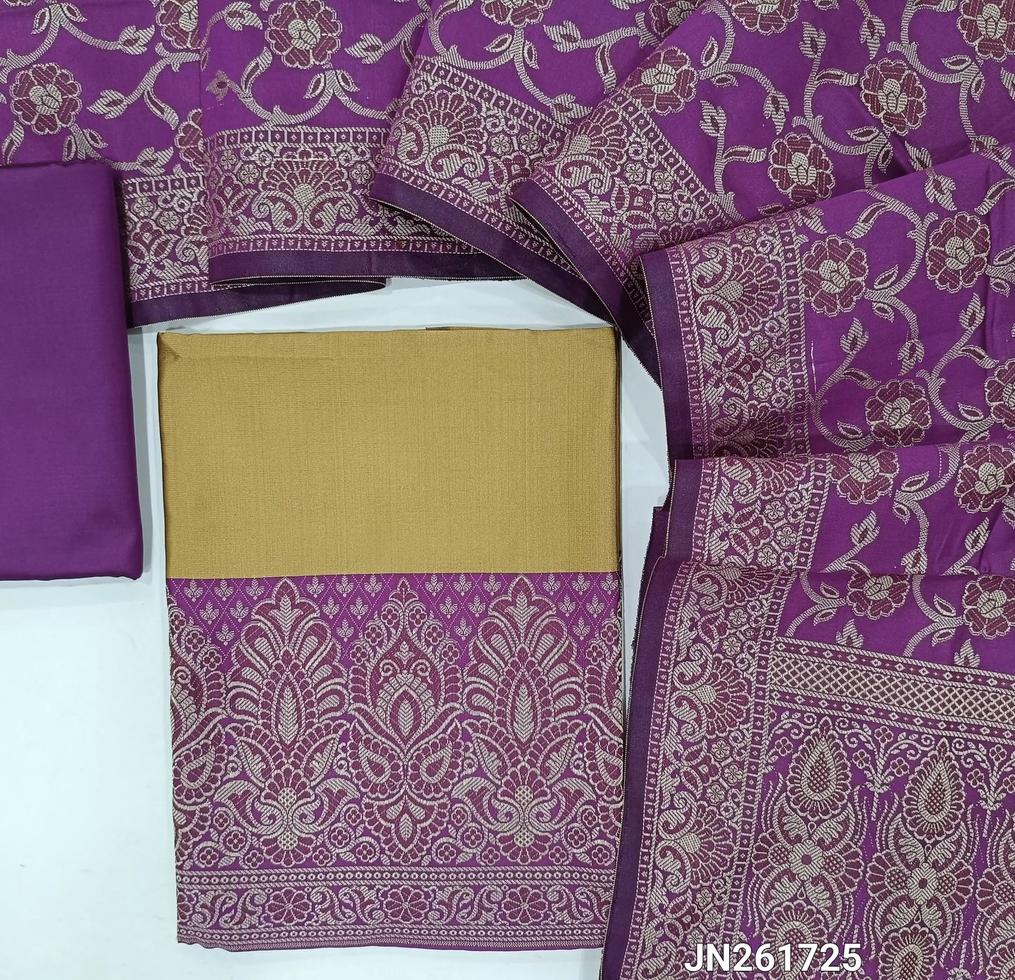 Rich beige premium silk cotton unstitched salwar material, brocade weaving on daman,(Lining needed)purple silk cotton bottom, brocade weaving on silk cotton full length dupatta with rich pallu and tassles. JN261725