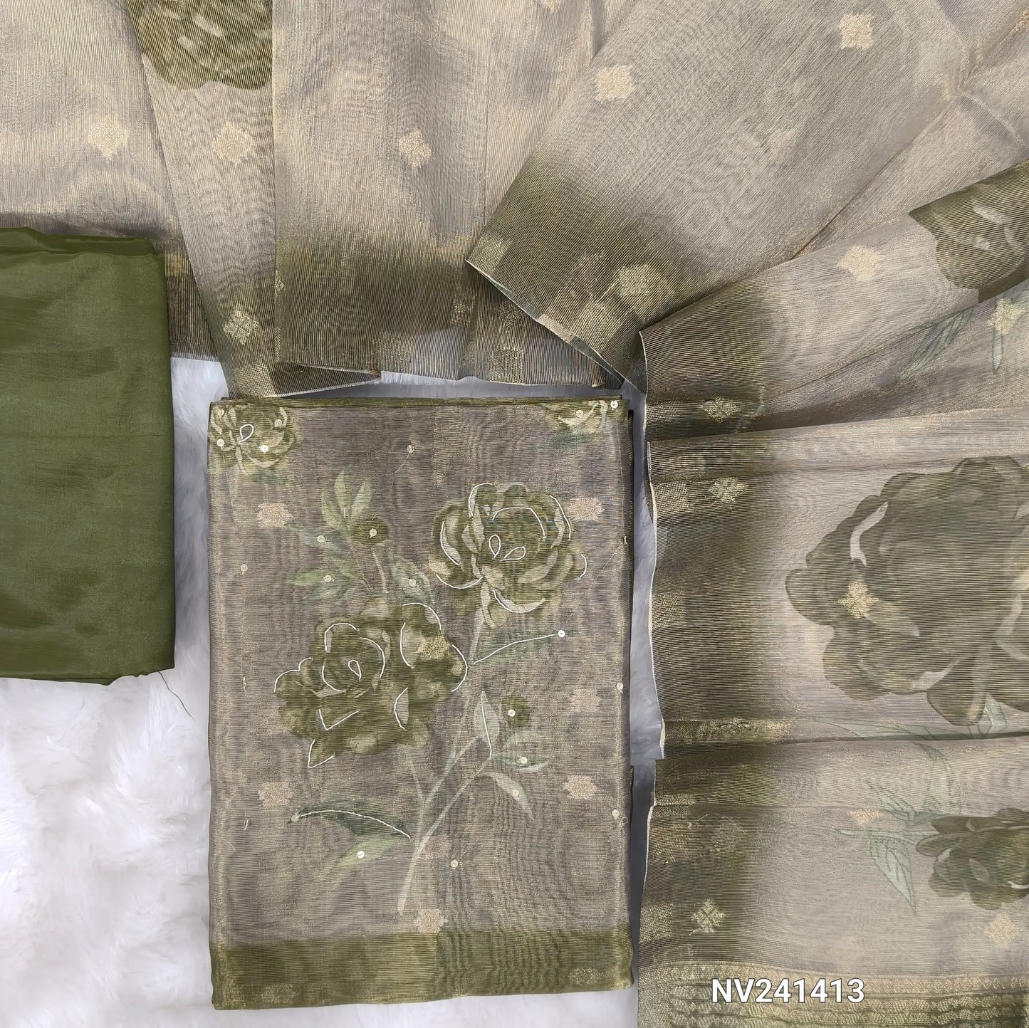 Olive green with golden tint tissue silk cotton unstitched salwar material, floral printed yoke with sequins& zardozi work, zari buttas all over(lining needed)matching silky bottom, floral printed tissue silk cotton dupatta. CODE NV241413