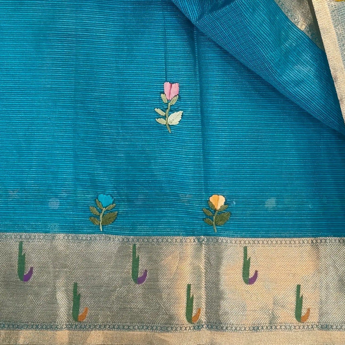Turquoise blue premium kota silk saree(soft, thin)with rich hand embroidery work all over,paithani woven double side borders,rich zari woven pallu,with hand embroidery & sequins work,running blouse with embroidery and borders. NS255