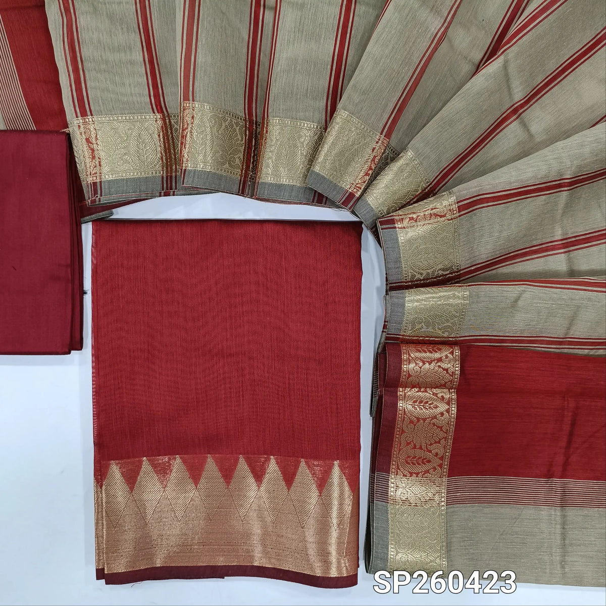 Reddish maroon semi maheshwari silk cotton unstitched salwar material, zari woven temple borders (Lining Needed) Matching silk cotton bottom, greyish beige silk cotton dupatta. SP260423