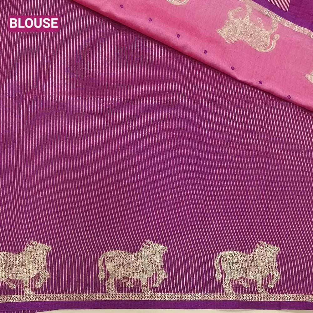 Pink with beetroot purple fancy silk cotton saree with thread woven buttas all over the body of the saree, double side borders with pichwai zari short pallu and zari striped blouse with cow motif weaving. CODE NS07