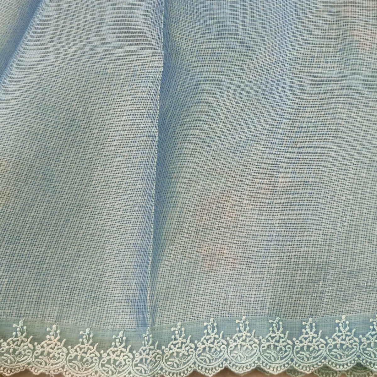 Pastel blue premium kota saree with embroidered bird and floral motifs all over (Thin, Lightweight) lace tapings as borders, rich embroidered pallu, plain running blouse. NS310