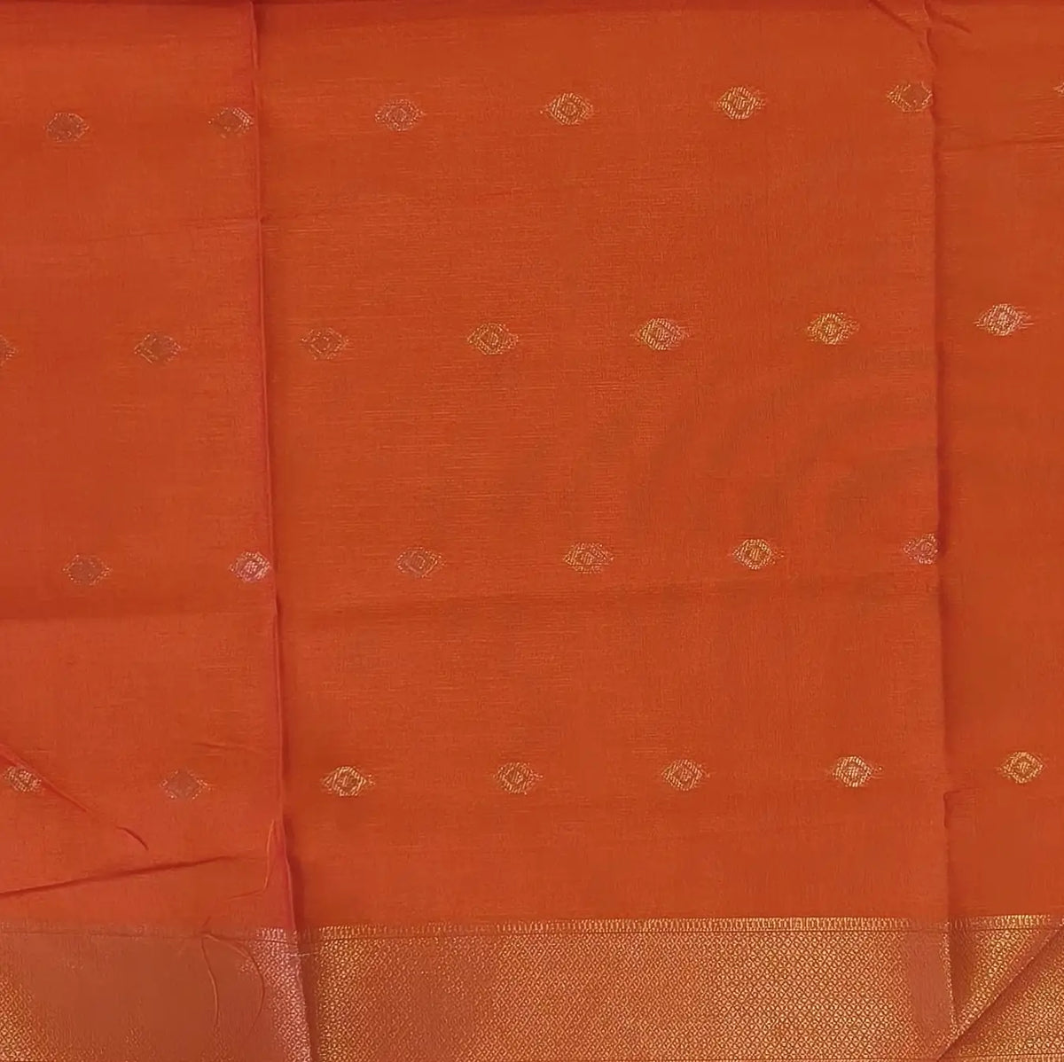 Orange semi tussar saree, with rich traditional zari weaving all over (thin, Textured) rich pallu, running blouse with zari woven buttas and borders. NS316