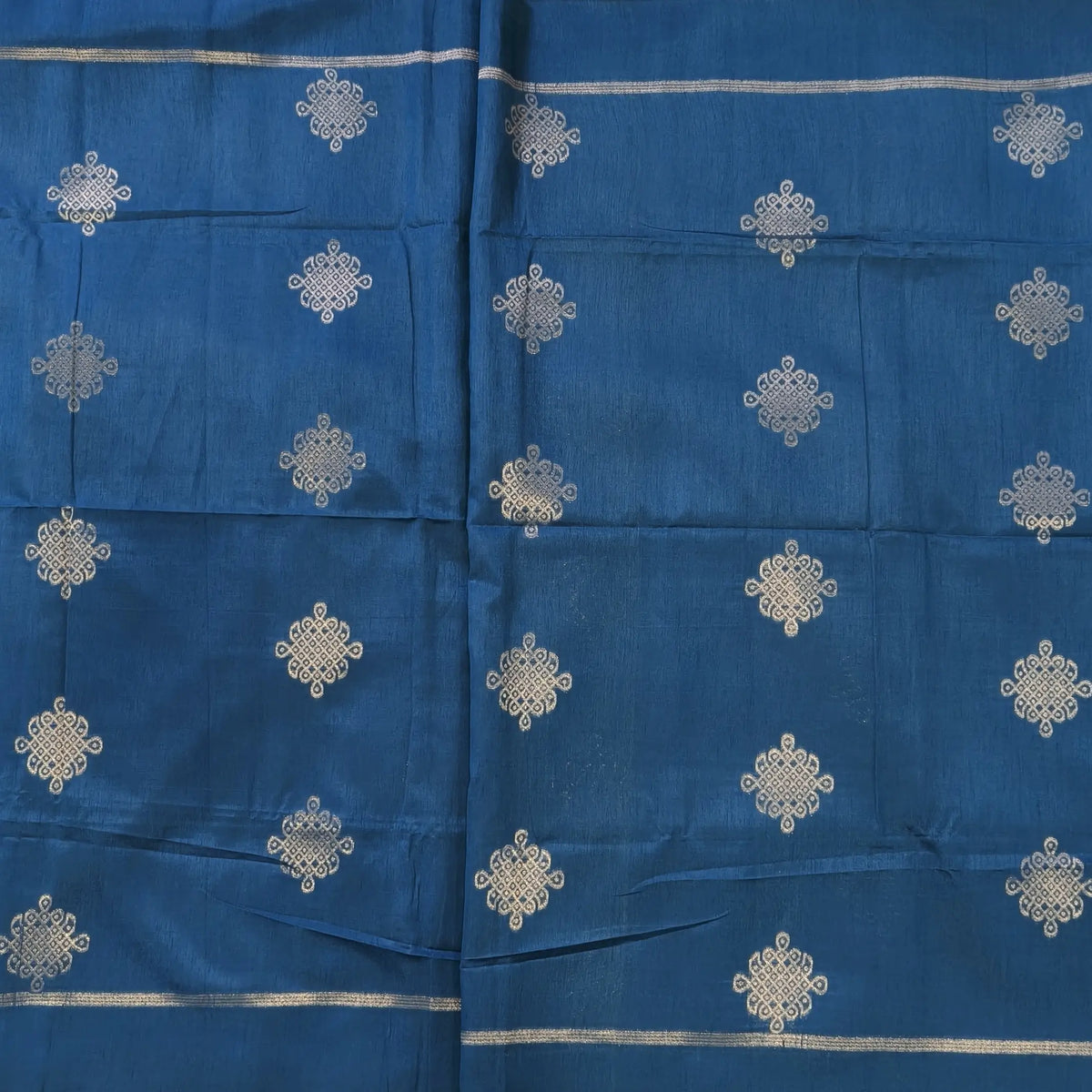 Dark turquoise blue semi tussar saree, with rich traditional zari weaving all over (thin, Textured) rich pallu, running blouse with zari woven buttas and borders. NS318