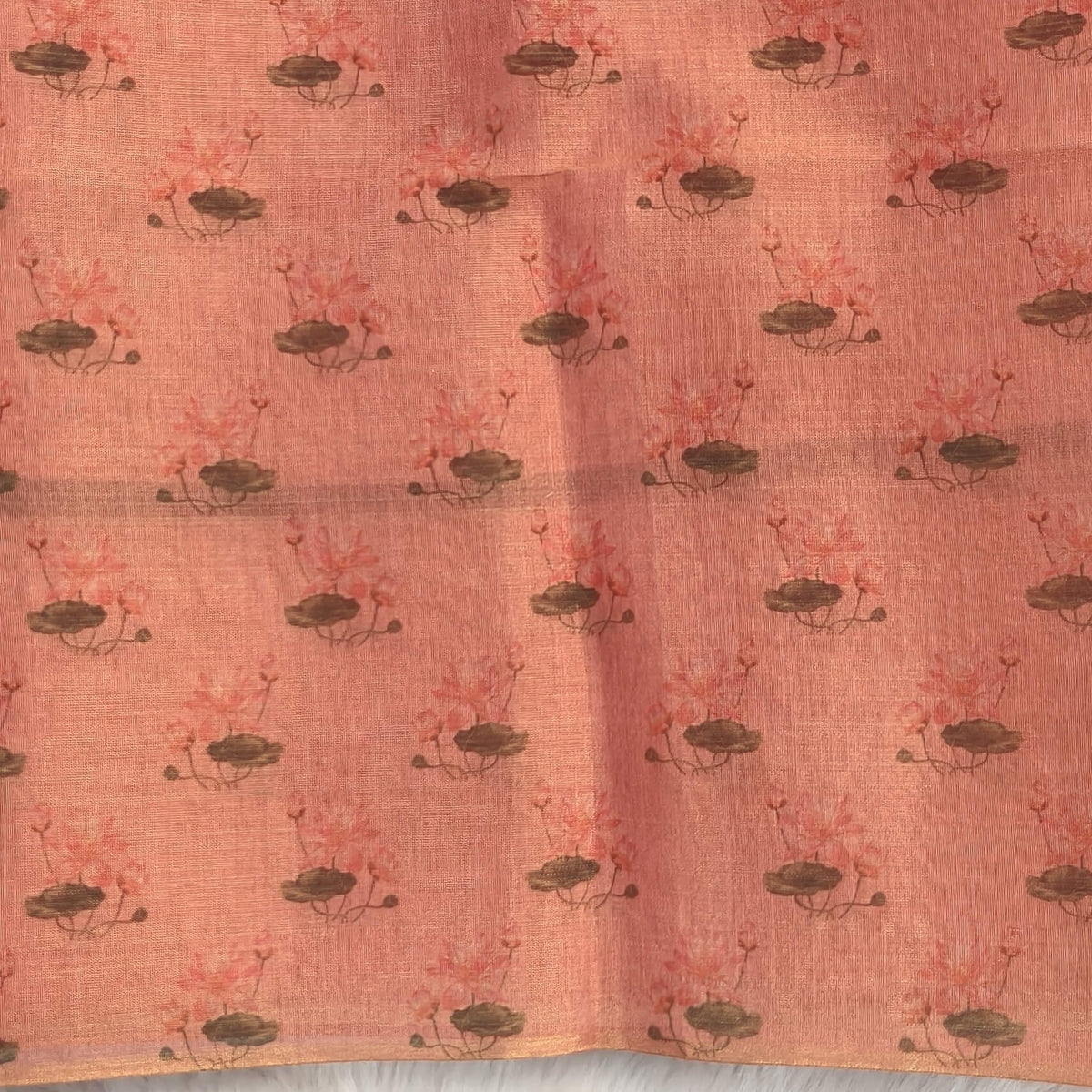 Pastel pink with golden tint tissue silk cotton saree(textured)with lotus digital prints all over,printed pallu,digital printed tissue silk cotton blouse with borders. NS268