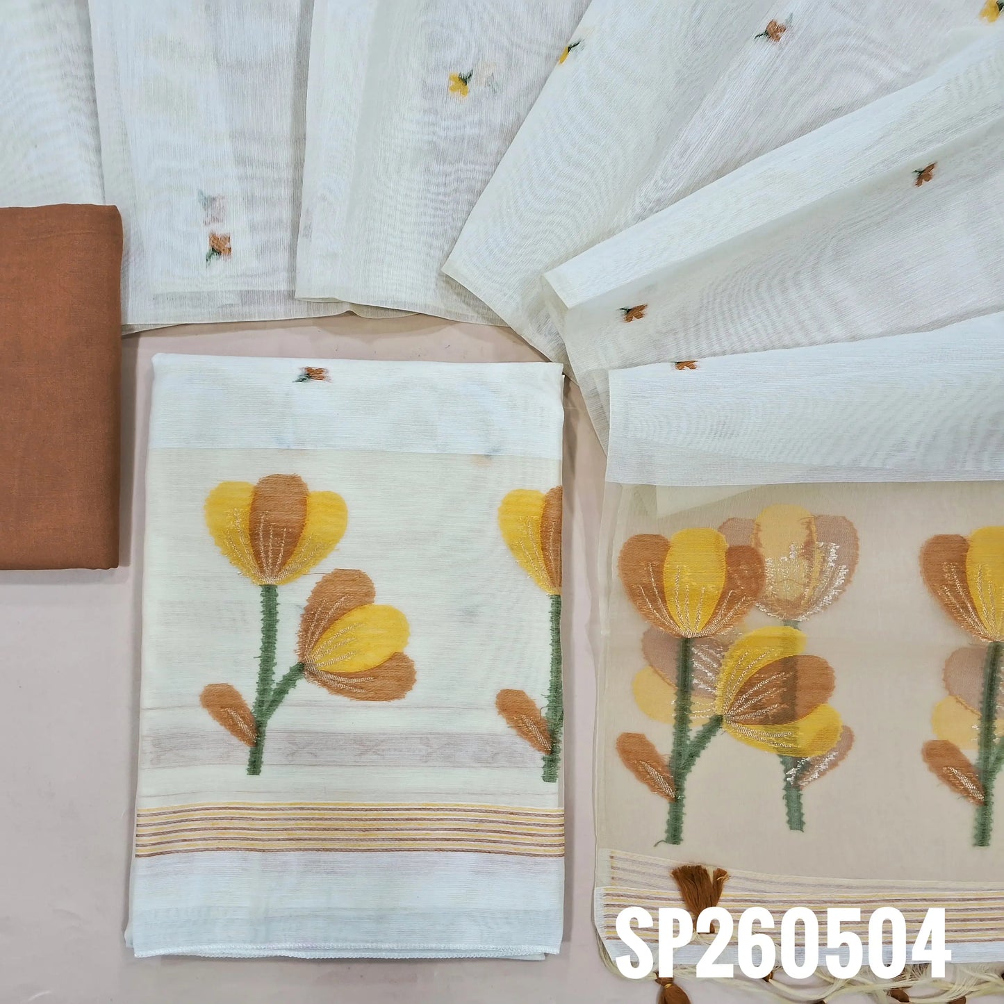 Off white designer silk cotton unstitched salwar material, jamdani weaving all over, organza daman with jamdani weaving (Thin, Lining Needed)yellow santoon bottom, jamdani woven silk cotton dupatta with organza pallu and tassels. SP260504