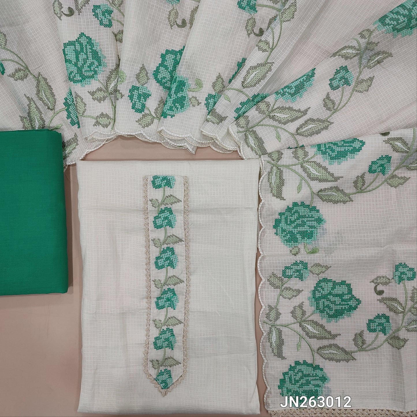Off white base kota unstitched salwar material,cross stitch embroidery work on yoke(Lining Needed)turquoise green cotton bottom,cross stitch embroidery work on kota dupatta with scallop edges .JN263012