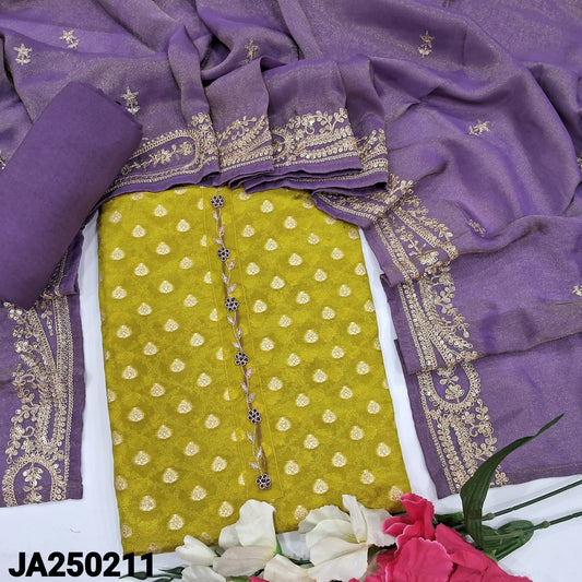 CODE JA250211 : Bright mehandhi green designer tissue organza silk unstitched salwar material, zardozi &thread work on yoke, zari buttas all over(thin fabric, lining needed)purple santoon bottom, tissue organza short width dupatta with zari &sequins work.