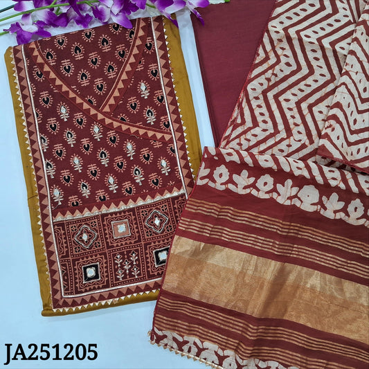 CODE JA251205 : Mehandhi yellow satin cotton unstitched salwar material, ajrak printed yoke with zari work(lining optional)maroon cotton bottom, batik dyed silk cotton dupatta with gold tissue pallu &kota lace tapings.