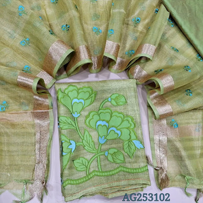 Pastel green designer tissue silk cotton unstitched salwar material, thin zari lines all over, applique work on daman(thin, lining needed)matching silk cotton bottom, embroidered tissue silk cotton dupatta with zari woven borders. CODE AG253102