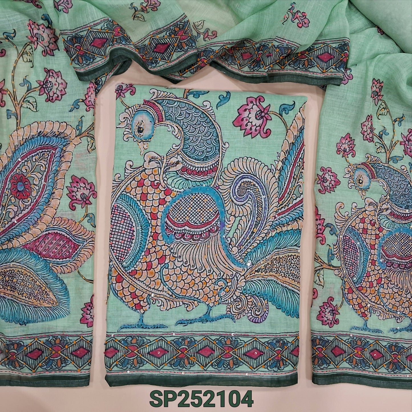 Pastel green premium linen kalamkari printed unstitched salwar material (textured, lining needed) rich hand embroidery work on daman, matching santoon bottom, kalamkari printed premium linen dupatta with rich embroidery. SP252104