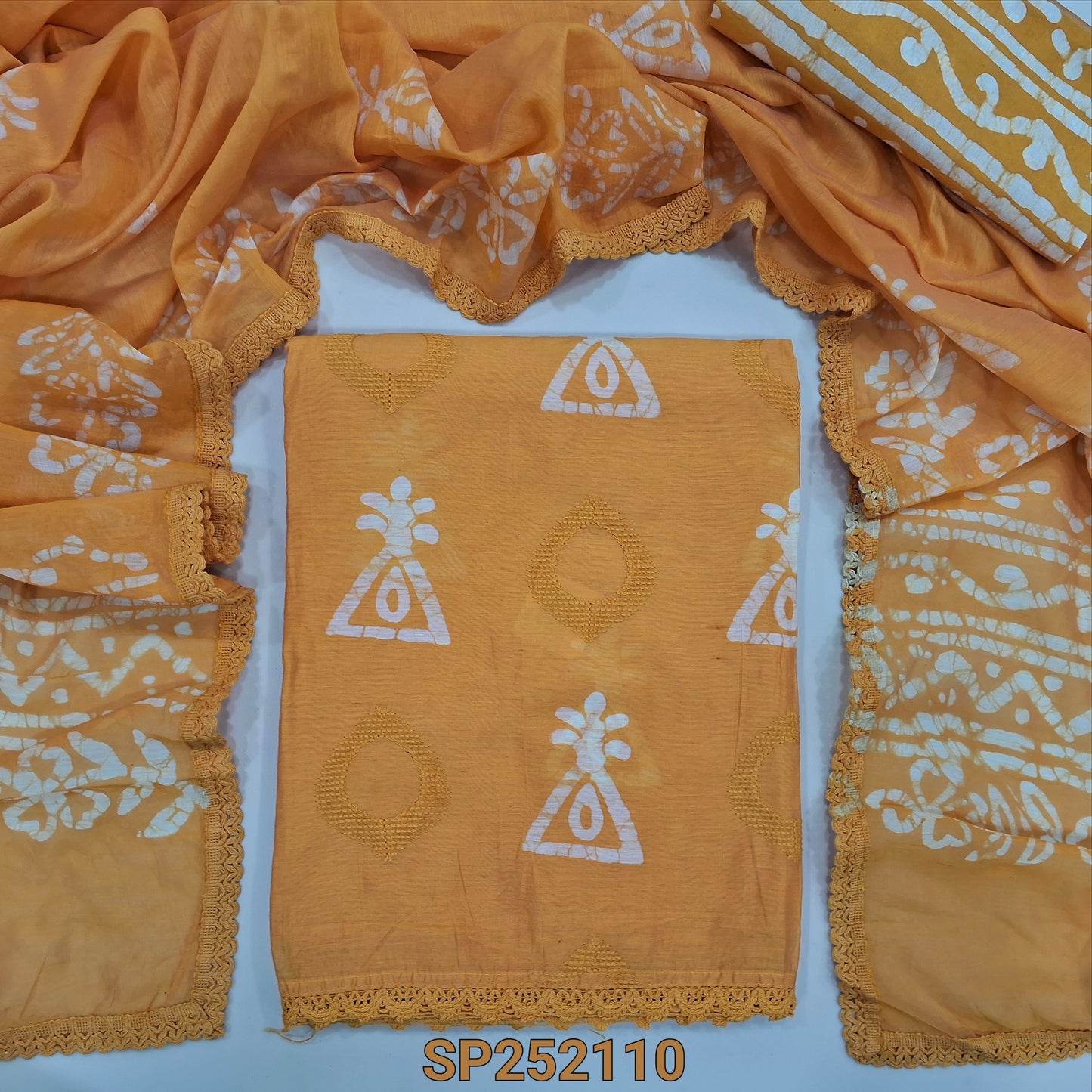 Mango Yellow Batik dyed fancy silk cotton unstitched salwar material, batik dye and embroidery work on front(lining needed) batik dyed santoon bottom and fancy silk cotton dupatta. SP252110