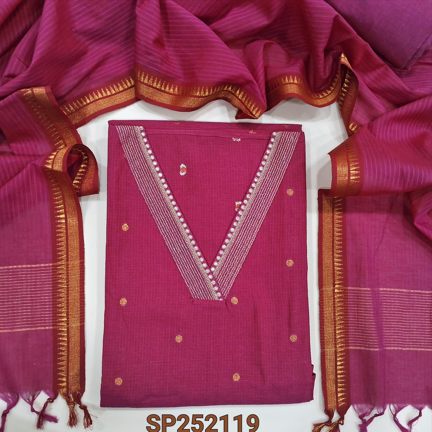 Pink Mercerized handloom cotton unstitched salwar material, V neckline with zari and sequins work, Zari Buttas all over(Thin, Lining Needed) Matching handloom cotton bottom and dupatta with temple borders and tassels. SP252119