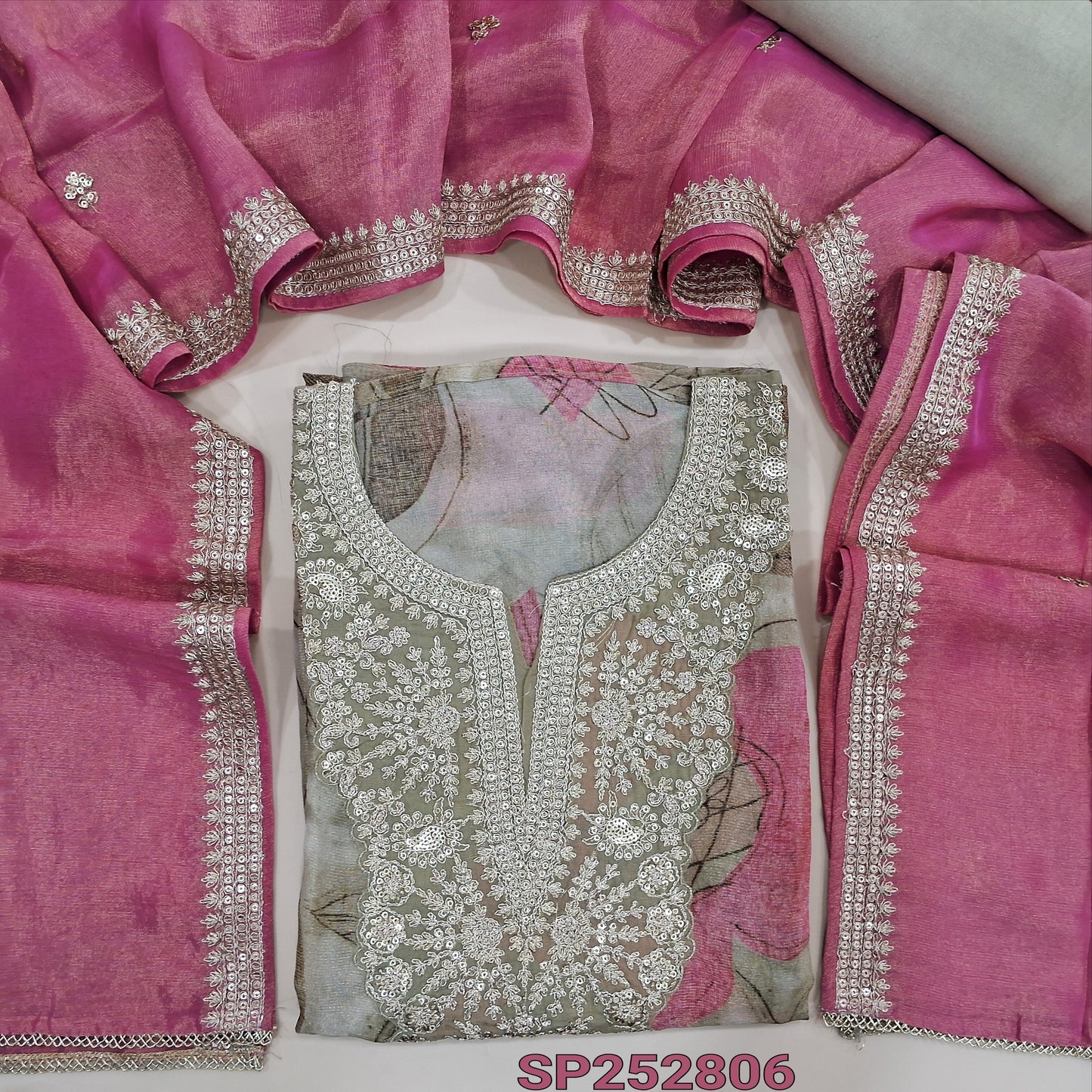 Beige tissue organza silk unstitched salwar material, printed all over, zari and sequins work on yoke (Soft, Silky, Lining Needed) Santoon Bottom, Pastel Pink tissue organza silk dupatta. SP252706