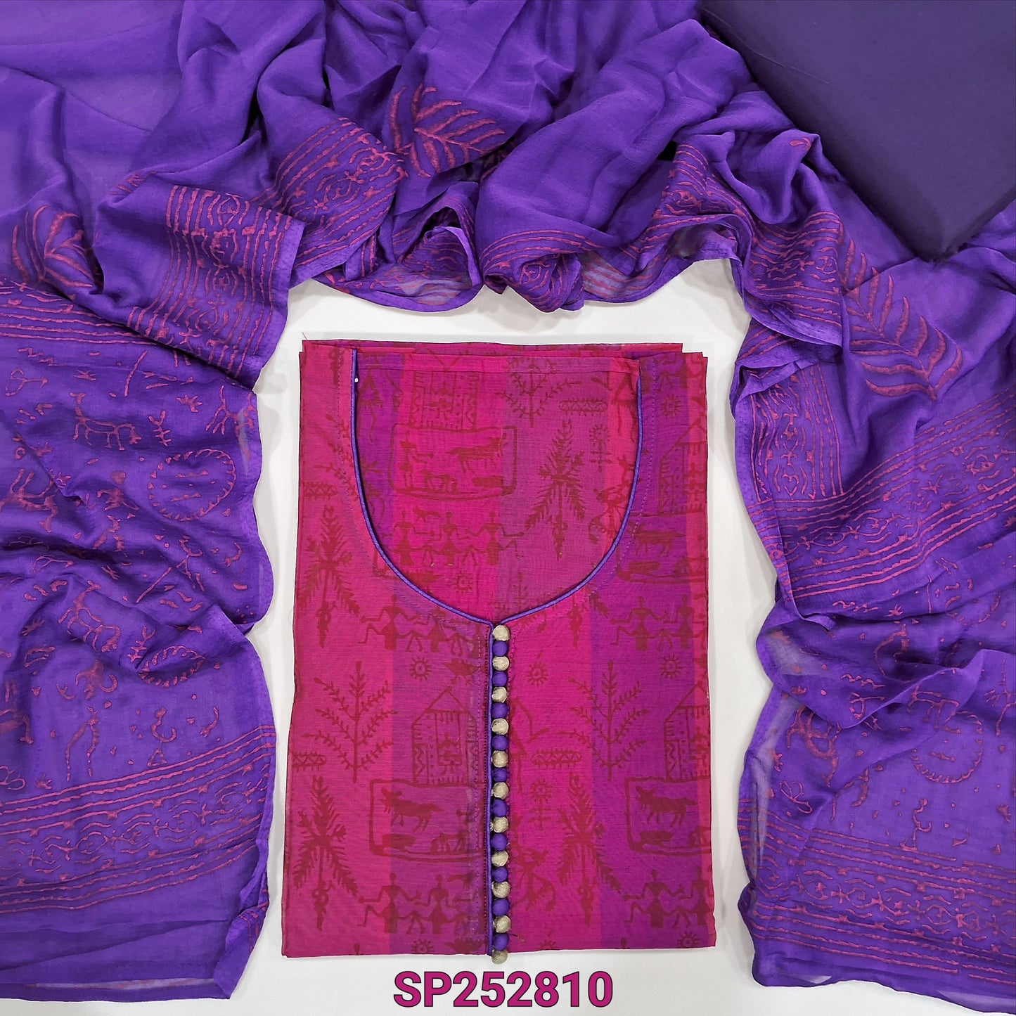 Bright Pink warli printed fancy silk cotton unstitched salwar material, potli buttons on yoke(lining needed) Purple cotton bottom, block printed chiffon dupatta. SP252810