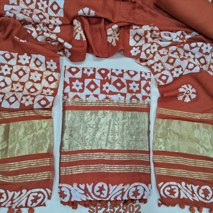 Brick Red original wax batik dyed fancy silk cotton unstitched salwar material, tapings and tissue on daman (Soft, Lining Needed) Matching spun cotton bottom, batik dyed soft silk cotton dupatta. SP252902