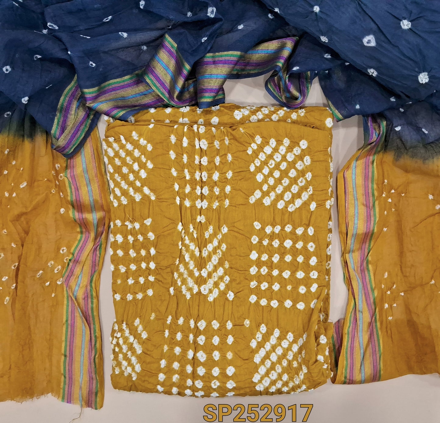 Mehandi Yellow Pure cotton orginal bandhini dyed unstitched salwar material, faux mirror work on front, Grey cotton bottom, tye-and-dye dupatta with borders. SP252917