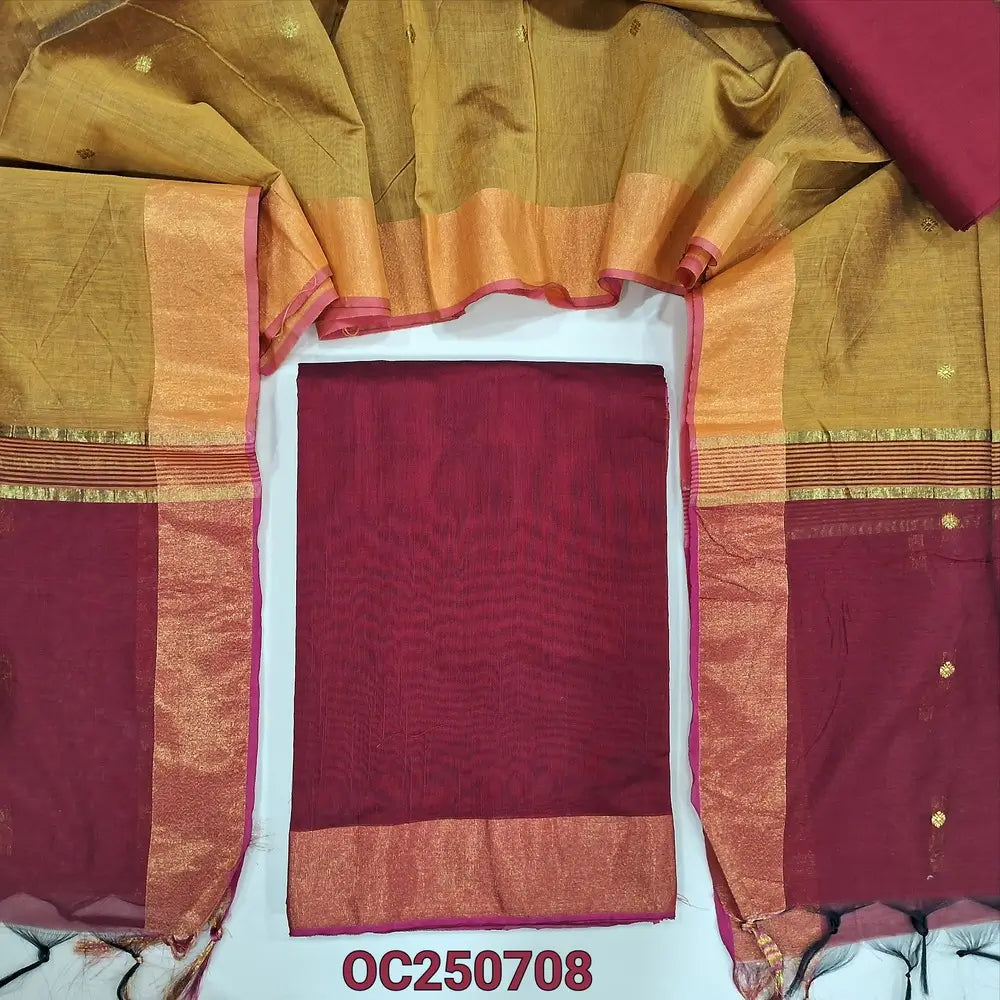 Reddish maroon and mehandi yellow silk cotton unstitched salwar material, gold tissue daman border (Lightweight, Thin, Lining Needed) matching silk cotton bottom, dual shaded silk cotton dupatta with zari woven buttas and borders. OC250708