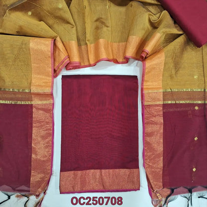 Reddish maroon and mehandi yellow silk cotton unstitched salwar material, gold tissue daman border (Lightweight, Thin, Lining Needed) matching silk cotton bottom, dual shaded silk cotton dupatta with zari woven buttas and borders. OC250708