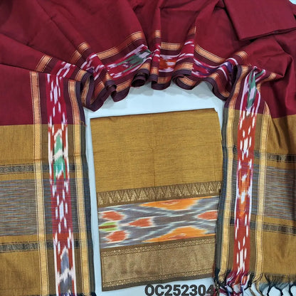 Mehandhi Yellow silk cotton unstitched salwar material, thread woven design on daman(lining needed) reddish maroon silk cotton bottom, dual shaded silk cotton dupatta with ikat woven borders & tassels. OC252304