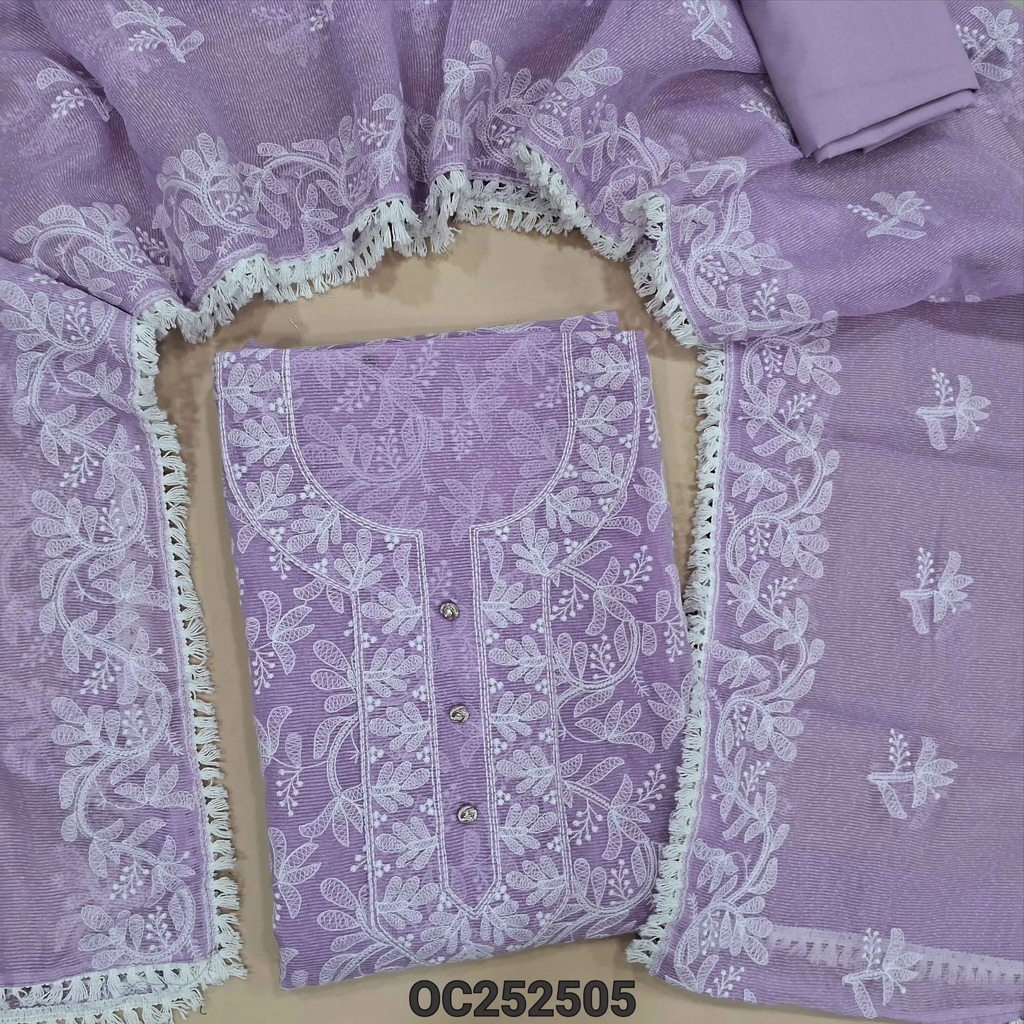 Lavender Noil fabric unstitched salwar material,(netted, lining needed) rich embroidery work on front, matching cotton bottom, embroidery work on noil fabric dupatta with lace tapings. OC252505