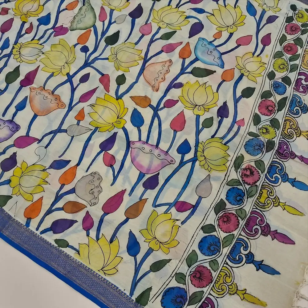 Bright turquoise blue premium raw silk unstitched salwar material (textured, Lining Needed) thread woven buttas all over, silver grey silk cotton bottom, original pen kalamkari silk dupatta with zari borders. NV251610