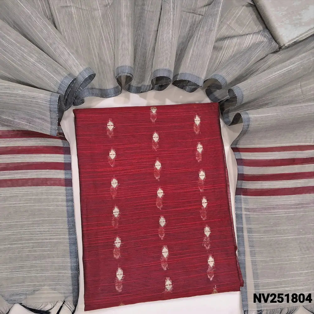 Dark Maroon Slub silk cotton unstitched salwar material, zari woven buttas all over (Weaving pattern might vary slightly, lining needed) beige silk cotton bottom, dupatta with striped pallu. NV251804