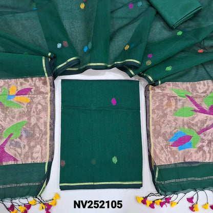 Bottle green muslin jamdani unstitched salwar material, hand woven design all over(thin, lining needed)matching silky bottom,hand woven muslin jamdani full length dupatta with rich paithani weaving pallu& hand made tassels. NV252105