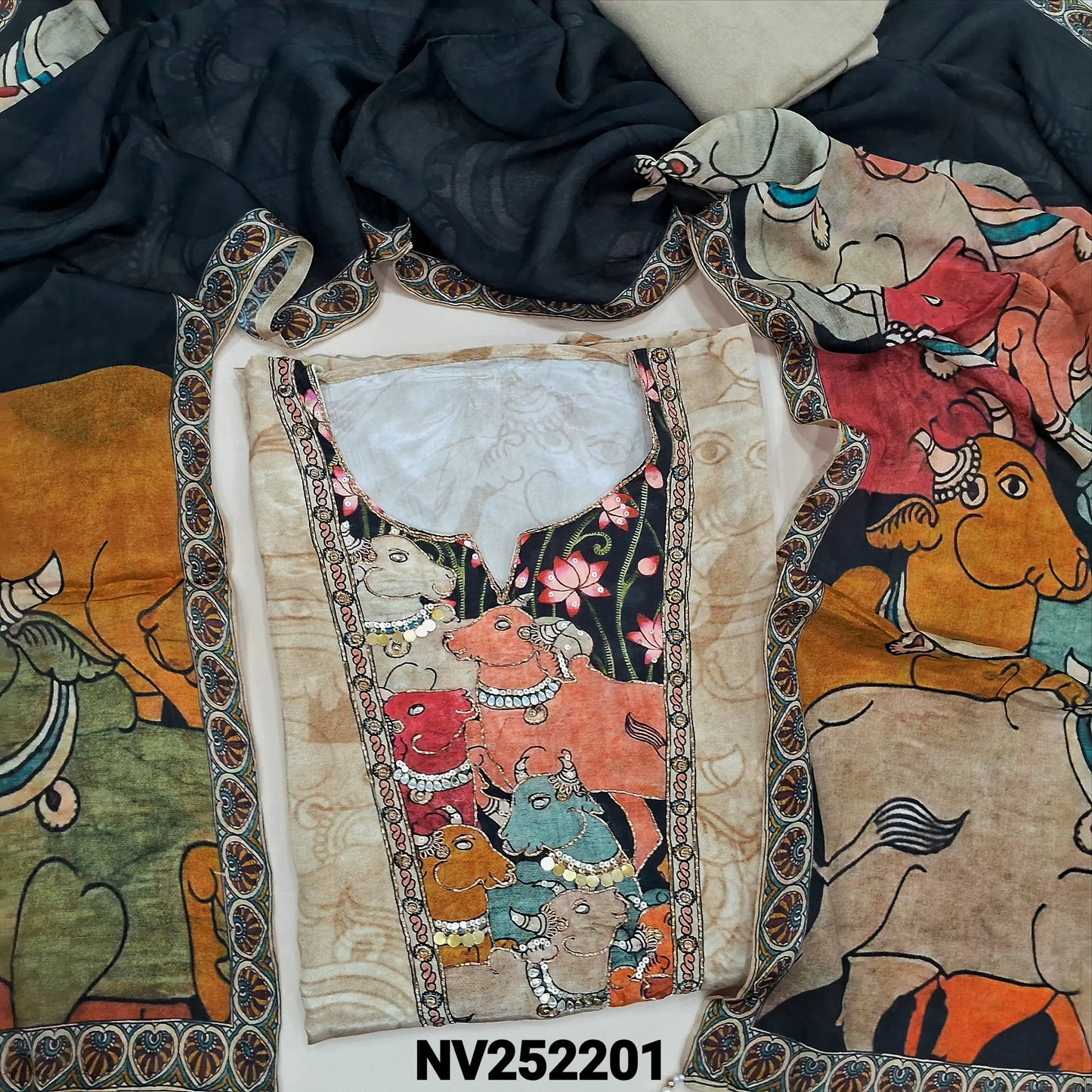 Designer rich beige pure muslin silk unstitched salwar material,pichawi design highlighted with zardozi,kundan,sequins work on yoke, (lining needed)printed all over, santoon bottom, colourful pichwai design on pure crepe silk short width dupatta. NV252201