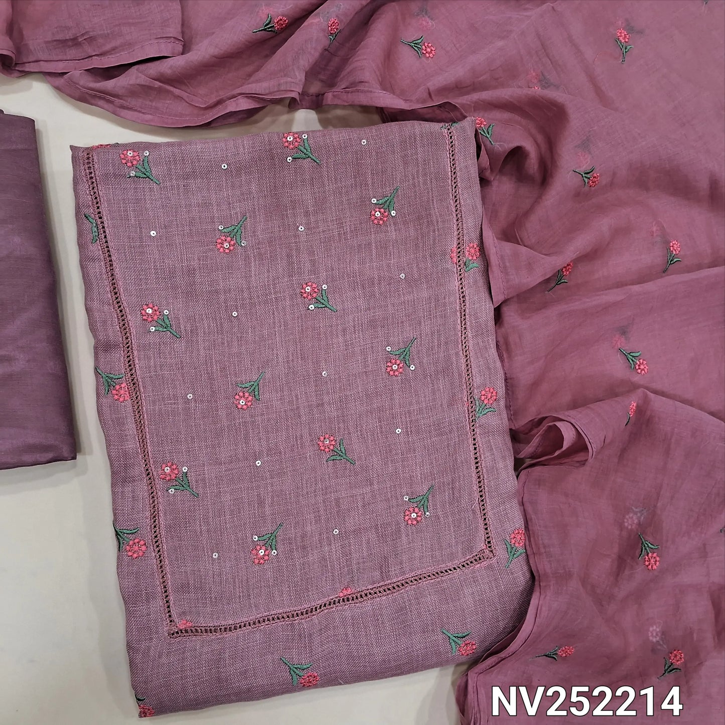 Light onion pink semi linen unstitched salwar material (textured,lining optional)crochet work on yoke, floral embroidery on front, matching silky bottom, embroidery work on fancy soft silk cotton dupatta. NV252214
