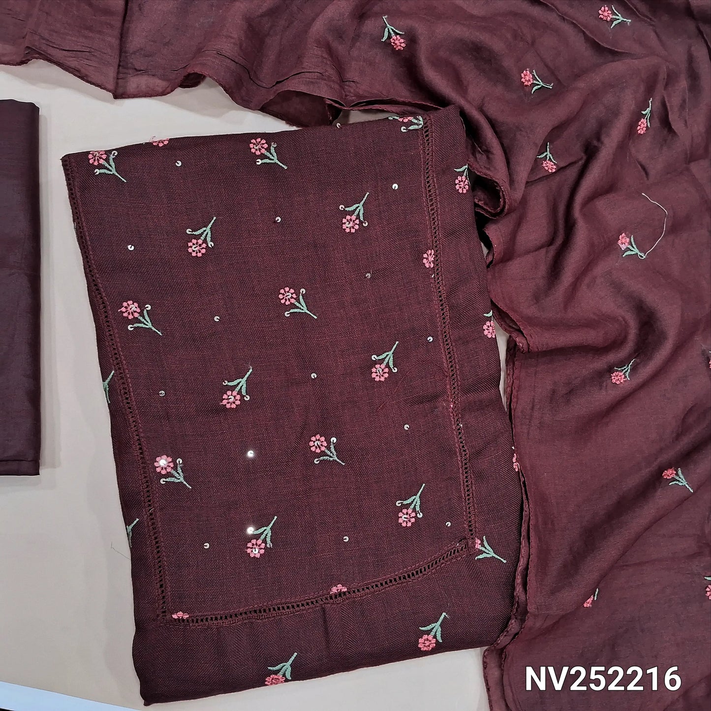 Dark maroon semi linen unstitched salwar material (textured,lining optional)crochet work on yoke, floral embroidery on front, matching silky bottom, embroidery work on fancy soft silk cotton dupatta. NV252216