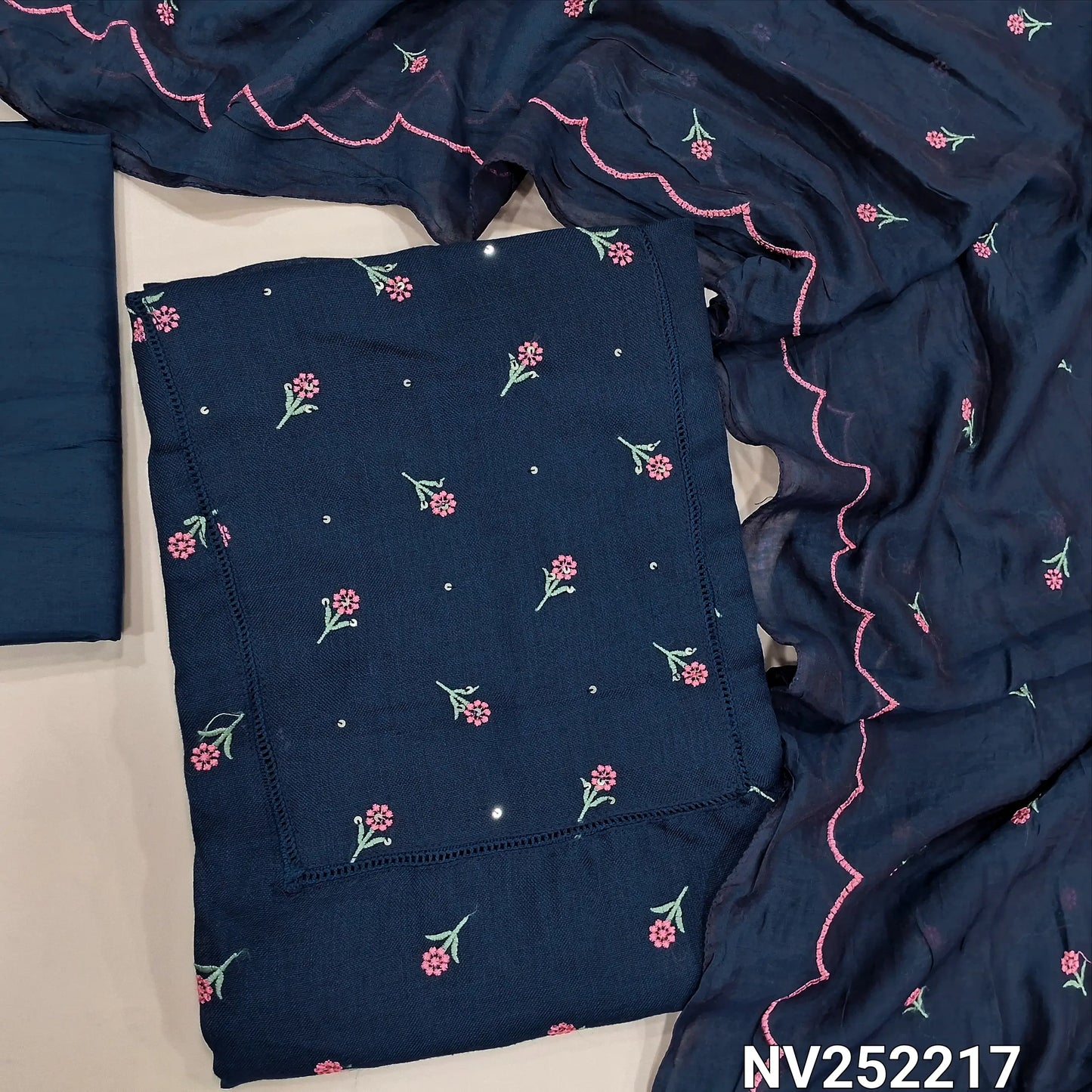 Dark blue semi linen unstitched salwar material (textured,lining optional)crochet work on yoke, floral embroidery on front, matching silky bottom, embroidery work on fancy soft silk cotton dupatta. NV252217