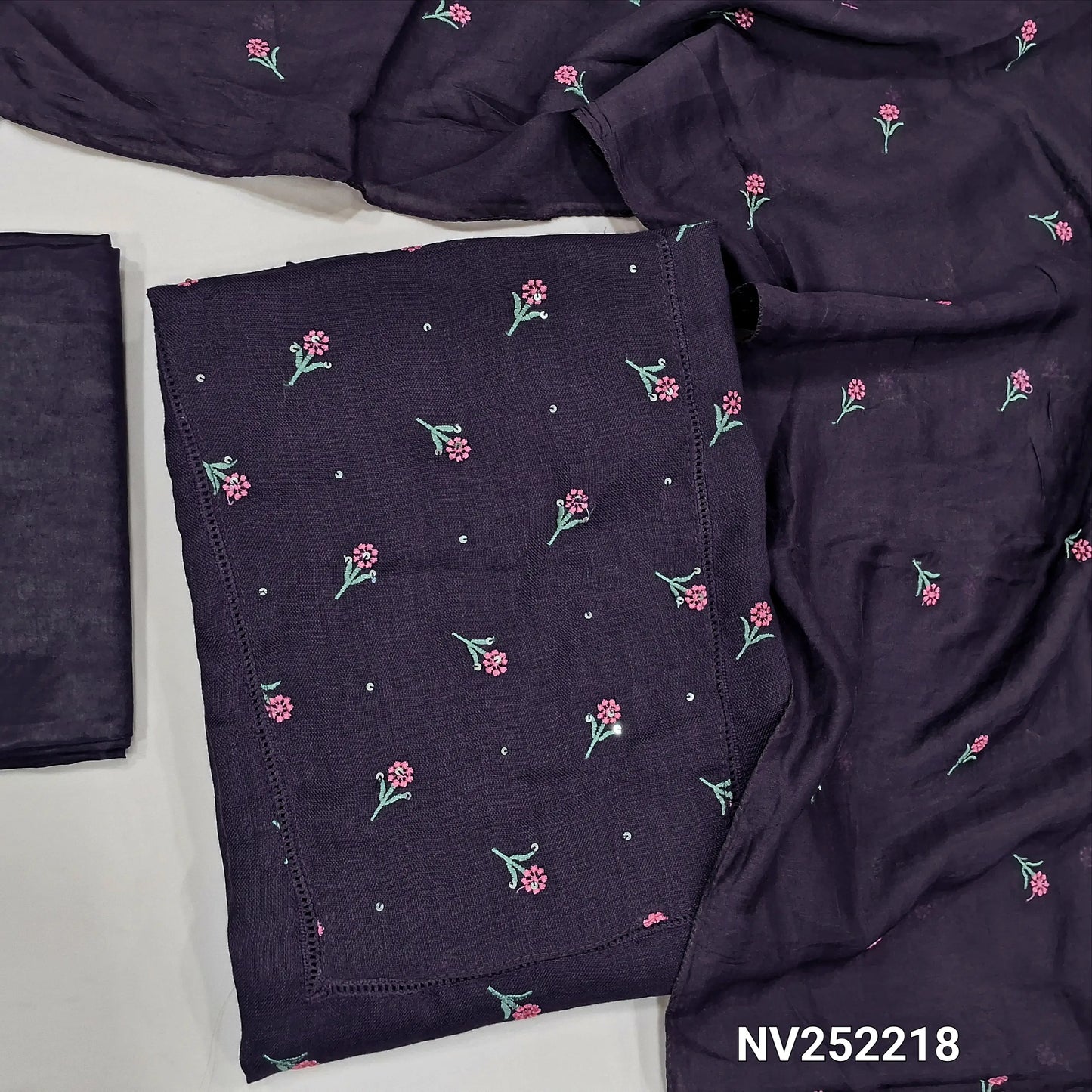 Dark purple semi linen unstitched salwar material (textured,lining optional)crochet work on yoke, floral embroidery on front, matching silky bottom, embroidery work on fancy soft silk cotton dupatta. NV252218