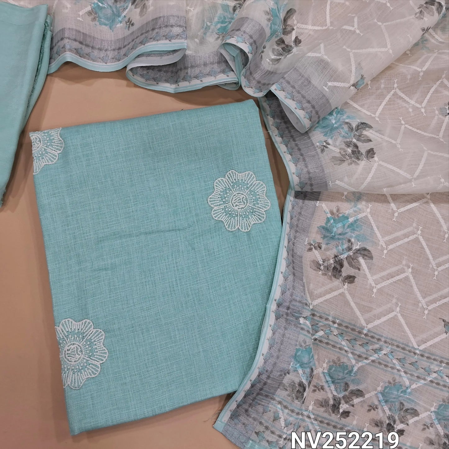Paste blue semi linen unstitched salwar material (textured,lining needed)thread embroidery on front,matching santoon bottom, rich embroidery work and floral printed semi linen dupatta. NV252219