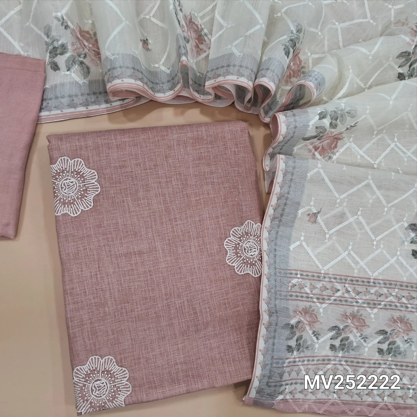 Onion pink semi linen unstitched salwar material (textured,lining needed)thread embroidery on front,matching santoon bottom, rich embroidery work and floral printed semi linen dupatta. NV252222