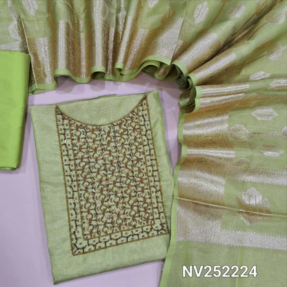 Light green with golden tint tissue silk cotton unstitched salwar material, cut bead and sugar bead work on yoke ( Lining Needed) Matching silk cotton bottom, rich benarasi woven tissue silk cotton full length dupatta with borders and tassles. NV252224