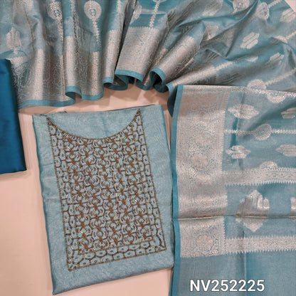 Pastel blue with golden tint tissue silk cotton unstitched salwar material, cut bead and sugar bead work on yoke ( Lining Needed) Matching silk cotton bottom, rich benarasi woven tissue silk cotton full length dupatta with borders and tassles. NV252225