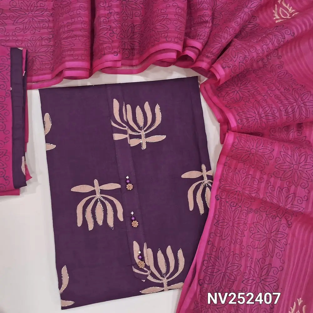 Purple pure cotton unstitched salwar material, prints highlighted with zari thread, simple yoke with buttons (Lining Optional) Pink coton bottom, blockprinted cotton dupatta with tapings. NV252407