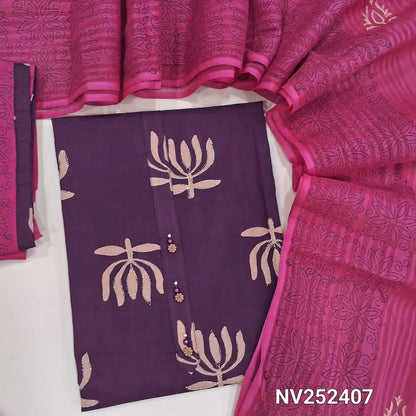 Purple pure cotton unstitched salwar material, prints highlighted with zari thread, simple yoke with buttons (Lining Optional) Pink coton bottom, blockprinted cotton dupatta with tapings. NV252407