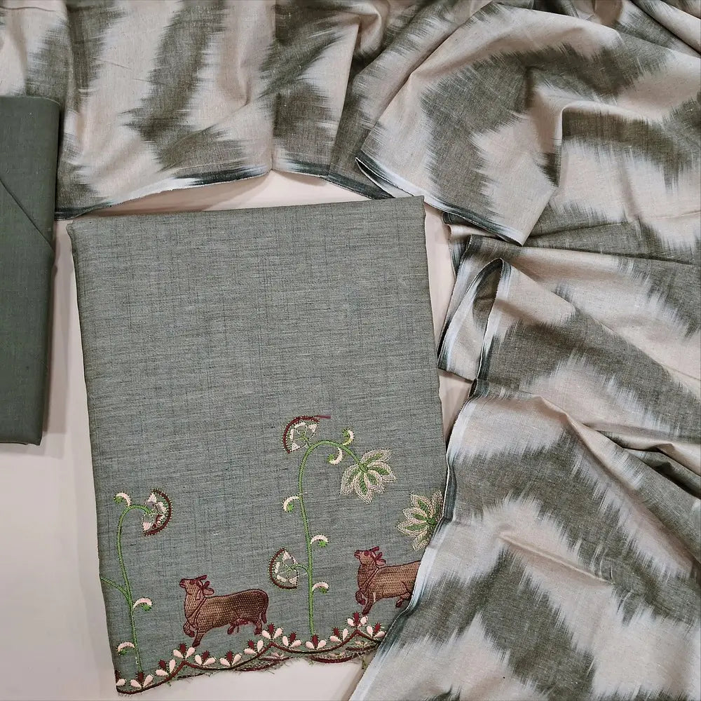 Greyish beige fancy silk cotton unstitched salwar material,pichwai embroidery work on yoke & daman, round notch neck  (Lining Needed) matching cotton bottom, ikat printed silk cotton dupatta. NV252605