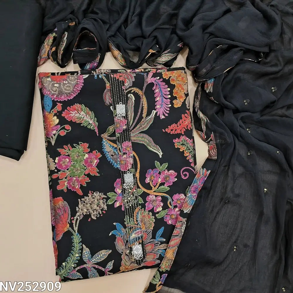 Black silk cotton unstitched salwar material (Lining optional) multicolor floral print all over, simple yoke,  matching spun cotton bottom,  sequins work on fancy chiffon dupatta with tapings. NV252909